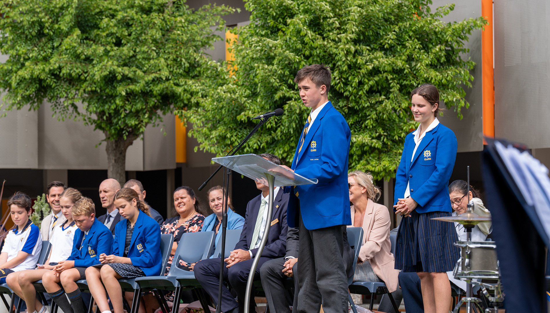 Senior School Captains speaking to a crowd.